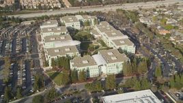 5K aerial stock footage of tilting to reveal Apple Headquarters office buildings, Cupertino, California Aerial Stock Footage | DFKSF12_012