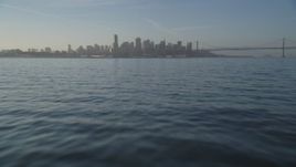 5K aerial stock footage of tilting from the bay to reveal the Downtown San Francisco skyline, California Aerial Stock Footage | DFKSF13_007