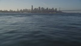 5K aerial stock footage fly low over bay toward downtown, tilt to the water, Downtown San Francisco, California Aerial Stock Footage | DFKSF13_009