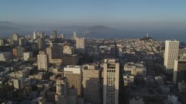 5K aerial stock footage of flying over Stockton Street with view of Mark Hopkins Hotel, Alcatraz in Nob Hill, San Francisco, California Aerial Stock Footage | DFKSF13_025