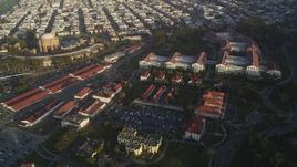 5K aerial stock footage fly over film studio at The Presidio, reveal distant skyline of Downtown San Francisco, California Aerial Stock Footage | DFKSF13_039