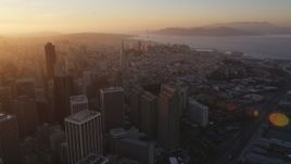 5K aerial stock footage of panning across downtown buildings and skyscrapers in Downtown San Francisco, California, sunset Aerial Stock Footage | DFKSF14_006