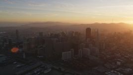 5K aerial stock footage of flying by skyscrapers at sunset in Downtown San Francisco, California Aerial Stock Footage | DFKSF14_007