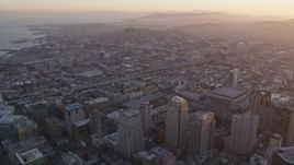 5K aerial stock footage pan from South of Market to San Francisco Marriott Marquis hotel, Downtown San Francisco, sunset Aerial Stock Footage | DFKSF14_009