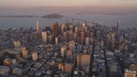 5K aerial stock footage of flying away from city buildings and skyscrapers in Downtown San Francisco, California, sunset Aerial Stock Footage | DFKSF14_011