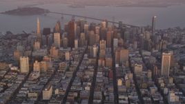 5K aerial stock footage video of towering skyscrapers and city buildings at sunset in Downtown San Francisco, California Aerial Stock Footage | DFKSF14_013