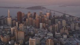 5K aerial stock footage of flying toward city buildings and skyscrapers in Downtown San Francisco, California, sunset Aerial Stock Footage | DFKSF14_015