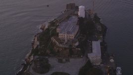 5K aerial stock footage flyby main buildings and lighthouse on Alcatraz island, San Francisco, California, twilight Aerial Stock Footage | DFKSF14_022
