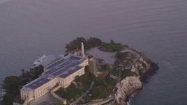 5K aerial stock footage of the main buildings and lighthouse on Alcatraz island, San Francisco, California, twilight Aerial Stock Footage | DFKSF14_024