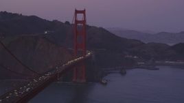 5K aerial stock footage of passing by the iconic Golden Gate Bridge, San Francisco, California, twilight Aerial Stock Footage | DFKSF14_038