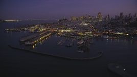 5K aerial stock footage of flying by iconic Fisherman's Wharf, San Francisco, California, twilight Aerial Stock Footage | DFKSF14_057