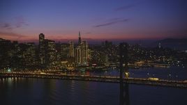 5K aerial stock footage of the Bay Bridge and Downtown San Francisco skyscrapers, California, twilight Aerial Stock Footage | DFKSF14_073