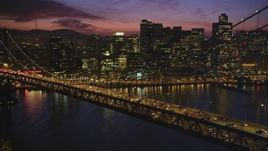 5K aerial stock footage flyby Bay Bridge at twilight, revealing Downtown San Francisco skyscrapers, California, twilight Aerial Stock Footage | DFKSF14_076