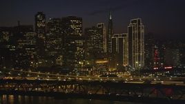 5K aerial stock footage of passing the Bay Bridge and Downtown San Francisco skyscrapers, California, night Aerial Stock Footage | DFKSF14_090