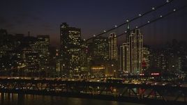 5K aerial stock footage of city skyscrapers seen from behind Bay Bridge, Downtown San Francisco, California, night Aerial Stock Footage | DFKSF14_091