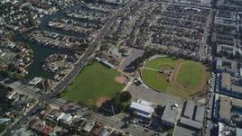 5K aerial stock footage of a reverse view of suburban neighborhoods and baseball fields, Alameda, California Aerial Stock Footage | DFKSF15_002
