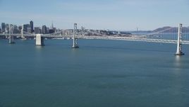 5K aerial stock footage of tilting from the bay revealing Bay Bridge, San Francisco, California Aerial Stock Footage | DFKSF15_003