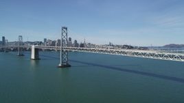 5K aerial stock footage of approaching the Bay Bridge, with views of Downtown San Francisco skyline, California Aerial Stock Footage | DFKSF15_006