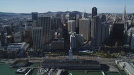 5K aerial stock footage of flying away from the Ferry Building and skyscrapers in Downtown San Francisco, California Aerial Stock Footage | DFKSF15_013