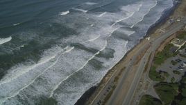 5K aerial stock footage video of a reverse view of ocean waves and Great Highway, Lakeshore District, San Francisco, California Aerial Stock Footage | DFKSF15_044