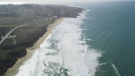 5K aerial stock footage of flying over Montara State Beach, tilt revealing coastal neighborhoods, Montara, California Aerial Stock Footage | DFKSF15_062