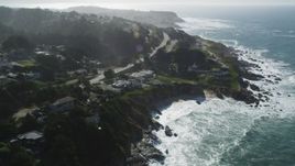 5K aerial stock footage of flying by coastal neighborhoods and tilting to lighthouse, Montara, California Aerial Stock Footage | DFKSF15_064