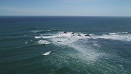 5K aerial stock footage of flying by waves crashing into rock formations, Half Moon Bay, California Aerial Stock Footage | DFKSF15_071