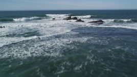 5K aerial stock footage tilt to reveal rock formations and fly out over ocean, Half Moon Bay, California Aerial Stock Footage | DFKSF15_073
