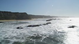 5K aerial stock footage fly low altitude by coastal cliffs and over rock formations, Half Moon Bay, California Aerial Stock Footage | DFKSF15_079
