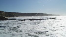 5K aerial stock footage of flying by coastal cliffs and over rock formations, Half Moon Bay, California Aerial Stock Footage | DFKSF15_080