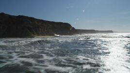 5K aerial stock footage of flying low over the ocean near cliffs, Half Moon Bay, California Aerial Stock Footage | DFKSF15_081