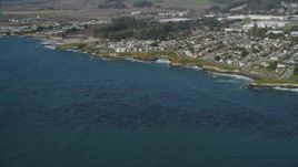 5K aerial stock footage of passing by kelp forests and coastal neighborhoods, Santa Cruz, California Aerial Stock Footage | DFKSF15_120