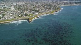 5K aerial stock footage of tilting from kelp forests to reveal coastal neighborhoods, Santa Cruz, California Aerial Stock Footage | DFKSF15_126