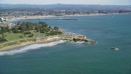 5K aerial stock footage of tilt from kelp forests to reveal coastal neighborhoods and Santa Cruz Wharf, Santa Cruz, California Aerial Stock Footage | DFKSF15_127