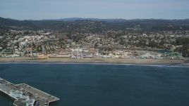 5K aerial stock footage of flying by the Santa Cruz Beach Boardwalk, Santa Cruz, California Aerial Stock Footage | DFKSF15_129