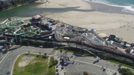 5K aerial stock footage of passing a roller coaster at Santa Cruz Beach Boardwalk, Santa Cruz, California Aerial Stock Footage | DFKSF15_136