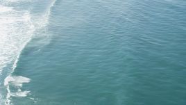 5K aerial stock footage of circling above seals and rolling waves, Moss Landing, California Aerial Stock Footage | DFKSF15_149