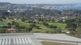 5K aerial stock footage tilt from golf course to reveal the coastal community of Monterey, California Aerial Stock Footage | DFKSF15_157