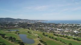 5K aerial stock footage approach Monterey Peninsula while flying over a golf course, Monterey, California Aerial Stock Footage | DFKSF16_001