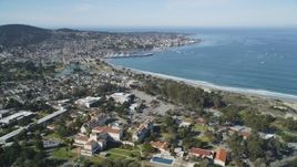 5K aerial stock footage tilt from highway interchange, reveal US Naval Postgraduate School and coastal community in Monterey, California Aerial Stock Footage | DFKSF16_003