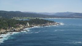 5K aerial stock footage of flying by oceanfront mansions on the coast in Pebble Beach, California Aerial Stock Footage | DFKSF16_024