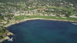 5K aerial stock footage tilt from Carmel Bay, reveal a resort hotel and golf course, Pebble Beach, California Aerial Stock Footage | DFKSF16_032