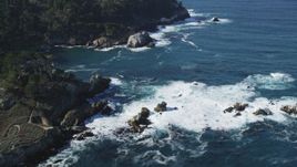 5K aerial stock footage of tilting from the coves along the coast to reveal coastal cliffs, Carmel, California Aerial Stock Footage | DFKSF16_044