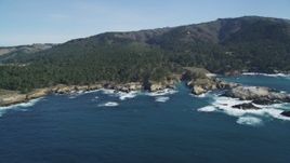 5K aerial stock footage of flying by rugged coastline with trees and rock formations, Carmel, California Aerial Stock Footage | DFKSF16_047