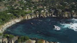5K aerial stock footage of flying by oceanfront homes and a cove, Carmel, California Aerial Stock Footage | DFKSF16_051