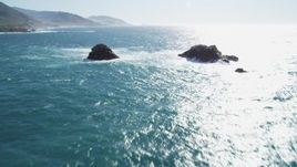5K aerial stock footage of tilting from the ocean to reveal coastal rock formations, Carmel, California Aerial Stock Footage | DFKSF16_052
