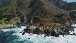 5K aerial stock footage of flying by the Highway 1 coastal road winding around the coastline, Carmel, California Aerial Stock Footage | DFKSF16_065