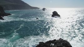 5K aerial stock footage of tilting from coastal rock formations, revealing cliffs, Big Sur, California Aerial Stock Footage | DFKSF16_071