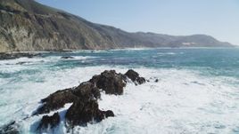 5K aerial stock footage of flying by and away from rock formations near coastal cliffs, Big Sur, California Aerial Stock Footage | DFKSF16_085