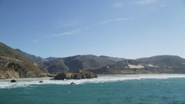 5K aerial stock footage of tilting from ocean kelp, reveal coastal rock formations and a beach, Big Sur, California Aerial Stock Footage | DFKSF16_087